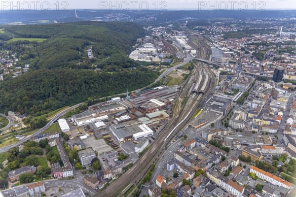 Aerial view, Deutsche Edelstahlwerke Schwanenstraße at Hagen main station and forest area Philippshöhe in the district Wehringhausen with the river Ennepe in Hagen, Ruhr area, North Rhine-Westphalia, Germany, railway tracks, railway station, DE, Deutsche Bahn AG, Europe, commercial enterprises, commercial area, commercial area, commercial park, commercial location, commercial use, Hagen, main station, main railway station, industrial area, industrial building, industrial location, aerial view, aerial photography, aerial photography, overview, bird's-eye view, forest area, birds-eyes view, overview