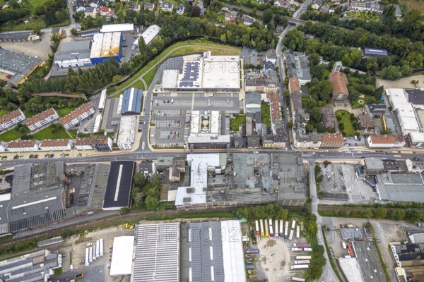 Aerial view, shopping centre and commercial area Enneper Straße as well as St. Konrad church and former Brandt factory in the Haspe-West district of Hagen, Ruhr area, North Rhine-Westphalia, Germany, place of worship, DE, shopping centre, shopping markets, shopping centre, Europe, commercial enterprises, commercial area, commercial park, commercial location, commercial use, religious community, place of worship, Hagen, holy site, industrial area, industrial site, church, church community, denomination, aerial view, aerial photography, aerial photography, local supply centre, religion, religious site, overview, bird's-eye view, overview