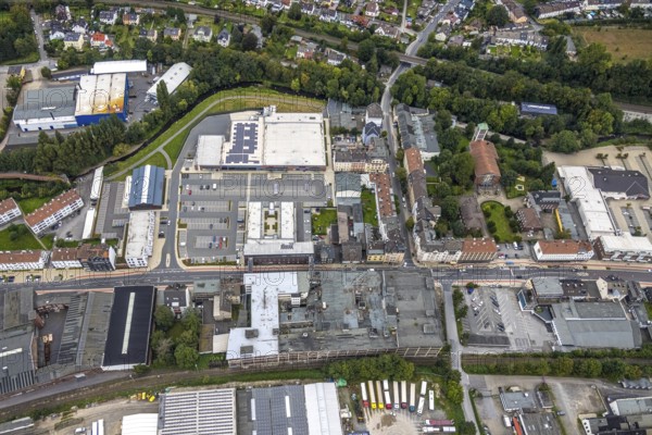 Aerial view, shopping centre and commercial area Enneper Straße as well as St. Konrad church and former Brandt factory in the Haspe-West district of Hagen, Ruhr area, North Rhine-Westphalia, Germany, place of worship, DE, shopping centre, shopping markets, shopping centre, Europe, commercial enterprises, commercial area, commercial park, commercial location, commercial use, religious community, place of worship, Hagen, holy site, industrial area, industrial site, church, church community, denomination, aerial view, aerial photography, aerial photography, local supply centre, religion, religious site, overview, bird's-eye view, overview