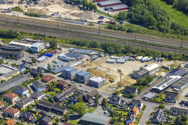 Aerial view, construction site at Annabergstraße for new construction of flats, former company site Klostermann, Haltern-Stadt, Haltern am See, Ruhr area, North Rhine-Westphalia, Germany, Annabergstraße, railway tracks, construction work, construction, construction area, building site, building plots, construction crane, construction measure, construction project, construction site, buses, DE, Europe, aerial view, aerial photography, aerial photography, new construction, recycling centre, overview, bird's eye view, birds-eyes view, overview