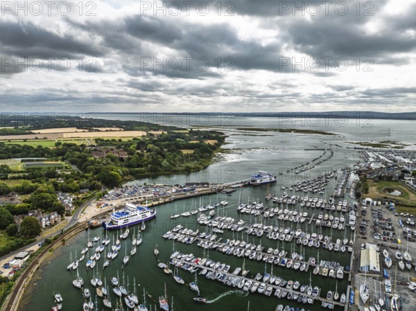 Wight Light car ferry to Isle of Wight on Lymington River and marina from drone, Lymington, New Forest, Hampshire, England, United Kingdom