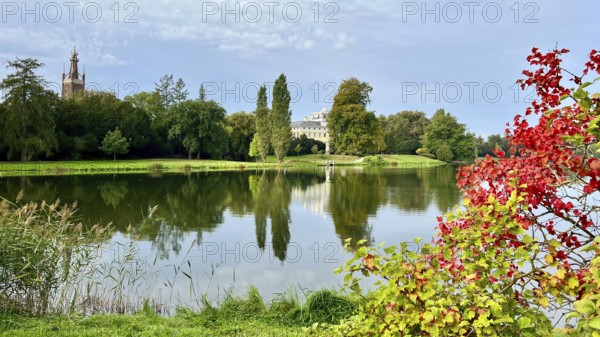 Wörlitz Park with a view of Wörlitz Palace, church, Dessau-Wörlitz Garden Kingdom, Unesco World Heritage Site, summer feeling, holiday destination, sunshine, Prince Friedrich Franz von Anhalt-Dessau, Dessau-Wörlitz Cultural Foundation, Middle Elbe Biosphere Reserve, Saxony-Anhalt, Germany