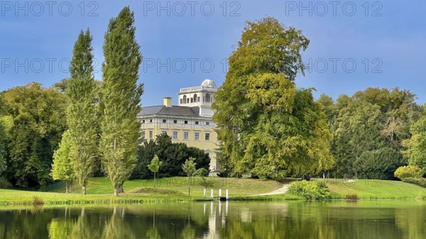 Wörlitz Park with a view of Wörlitz Palace, church, Dessau-Wörlitz Garden Kingdom, Unesco World Heritage Site, summer feeling, holiday destination, sunshine, Prince Friedrich Franz von Anhalt-Dessau, Dessau-Wörlitz Cultural Foundation, Middle Elbe Biosphere Reserve, Saxony-Anhalt, Germany