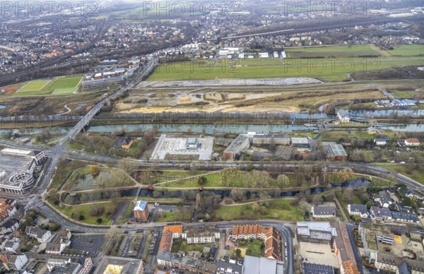 Aerial view construction area new water sports centre on Adenauerallee at Hammonense grammar school with transition to Nordring and Hans-Böckler-Platz in Hamm, Ruhr area, North Rhine-Westphalia, Germany, construction work, construction vehicles, construction area, construction site, building plots, construction crane, construction measure, construction project, construction site, education, educational institution, DE, Datteln-Hamm Canal, development, Europe, Hamm airfield, River Lippe, business park, grammar school, Hamm, industrial area, canal edge, educational institute, Lippe floodplain, aerial photograph, aerial photography, aerial photography, Rhine-Ruhr metropolitan region, new construction, shipping, Hamm lock, school, overview, bird's-eye view, overview