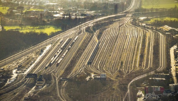 Aerial view shunting yard and freight yard in backlight in Hamm, Ruhr area, North Rhine-Westphalia, Germany, railway tracks, railway station, DE, Deutsche Bahn AG, Europe, backlight, railway tracks, Hamm, aerial view, aerial photograph, aerial photography, aerial photography, Rhine-Ruhr metropolitan region, overview, bird's eye view, birds-eyes view, former signal box, overview