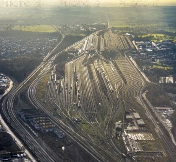 Aerial view shunting yard and freight yard in backlight in Hamm, Ruhr area, North Rhine-Westphalia, Germany, railway tracks, railway station, DE, Deutsche Bahn AG, Europe, backlight, railway tracks, Hamm, aerial view, aerial photograph, aerial photography, aerial photography, Rhine-Ruhr metropolitan region, overview, bird's eye view, birds-eyes view, former signal box, overview