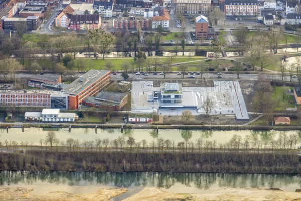 Aerial view construction area new water sports centre on Adenauerallee at Hammonense grammar school with transition to Nordring and Hans-Böckler-Platz in Hamm, Ruhr area, North Rhine-Westphalia, Germany, construction work, construction vehicles, construction area, construction site, building plots, construction crane, construction measure, construction project, construction site, education, educational institution, DE, Datteln-Hamm Canal, development, Europe, river Lippe, business park, grammar school, Hamm, industrial area, canal edge, educational institute, aerial view, aerial photograph, aerial photography, aerial photography, Rhine-Ruhr metropolitan region, new building, shipping, school, overview, bird's-eye view, overview