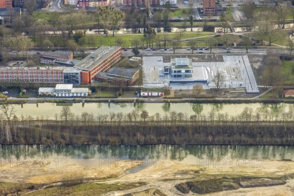 Aerial view construction area new water sports centre on Adenauerallee at Hammonense grammar school with transition to Nordring and Hans-Böckler-Platz in Hamm, Ruhr area, North Rhine-Westphalia, Germany, construction work, construction vehicles, construction area, construction site, building plots, construction crane, construction measure, construction project, construction site, education, educational institution, DE, Datteln-Hamm Canal, development, Europe, river Lippe, business park, grammar school, Hamm, industrial area, canal edge, educational institute, aerial view, aerial photograph, aerial photography, aerial photography, Rhine-Ruhr metropolitan region, new building, shipping, school, overview, bird's-eye view, overview