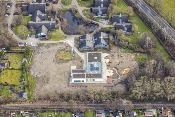 Aerial view of the AhsePark housing estate on Caldenhofer Weg with a new day care centre in Hamm, Ruhr area, North Rhine-Westphalia, Germany, Ahsestrolche, construction work, construction, construction vehicles, construction area, building site, building plots, construction crane, construction measure, construction project, construction site, DE, development, Europe, Hamm, real estate, capacity requirement, kindergarten, day-care centre, day-care facility, day-care centre, aerial photograph, aerial photography, aerial photography, Rhine-Ruhr metropolitan region, new building, overview, bird's-eye view, residential complex, residential area, residential buildings, residential quarter, housing estate, birds-eyes view, former Glunz village, overview