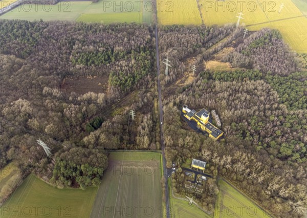 Aerial view of Ost Schacht Sandbochum mine in a forest area, steag substation Sandbochum, Kerstheider Straße in Hamm, Ruhr area, North Rhine-Westphalia, Germany, Ost colliery, DE, Europe, Hamm, Heinrich Robert Schacht Sandbochum, aerial view, aerial photography, aerial photography, aerial photography, Rhine-Ruhr metropolitan region, overview, substation, bird's eye view, forest area, birds-eyes view, former Ost colliery, overview