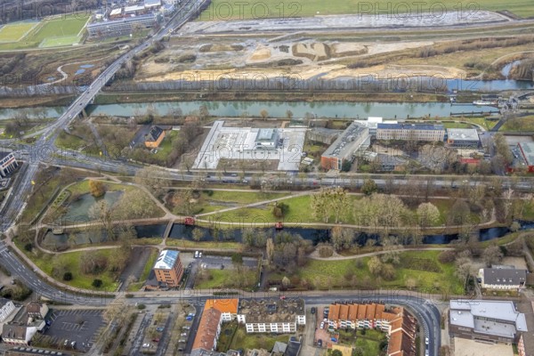 Aerial view construction area new water sports centre on Adenauerallee at Hammonense grammar school with transition to Nordring and Hans-Böckler-Platz in Hamm, Ruhr area, North Rhine-Westphalia, Germany, construction work, construction vehicles, construction area, construction site, building plots, construction crane, construction measure, construction project, construction site, education, educational institution, DE, Datteln-Hamm Canal, development, Europe, river Lippe, business park, grammar school, Hamm, industrial area, canal edge, educational institute, aerial view, aerial photograph, aerial photography, aerial photography, Rhine-Ruhr metropolitan region, new building, shipping, school, overview, bird's-eye view, overview