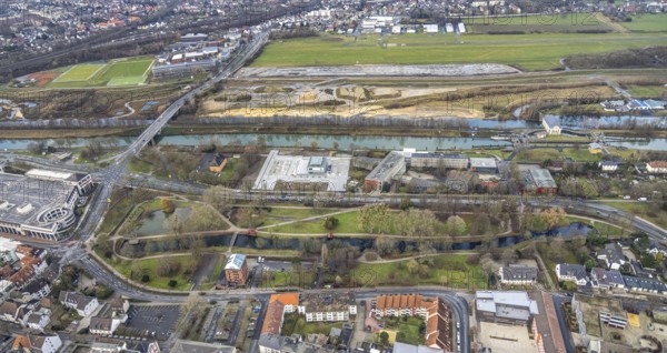 Aerial view construction area new water sports centre on Adenauerallee at Hammonense grammar school with transition to Nordring and Hans-Böckler-Platz in Hamm, Ruhr area, North Rhine-Westphalia, Germany, construction work, construction vehicles, construction area, construction site, building plots, construction crane, construction measure, construction project, construction site, education, educational institution, DE, Datteln-Hamm Canal, development, Europe, Hamm airfield, River Lippe, business park, grammar school, Hamm, industrial area, canal edge, educational institute, Lippe floodplain, aerial photograph, aerial photography, aerial photography, Rhine-Ruhr metropolitan region, new construction, shipping, Hamm lock, school, overview, bird's-eye view, overview