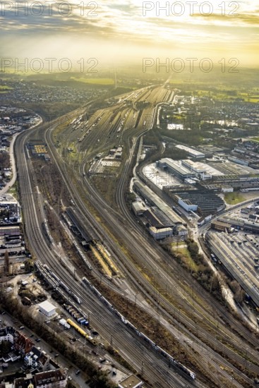 Aerial view shunting yard and freight yard in backlight in Hamm, Ruhr area, North Rhine-Westphalia, Germany, railway tracks, railway station, DE, Deutsche Bahn AG, Europe, backlight, railway tracks, Hamm, aerial view, aerial photograph, aerial photography, aerial photography, Rhine-Ruhr metropolitan region, overview, bird's eye view, birds-eyes view, former signal box, overview