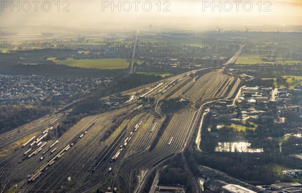 Aerial view shunting yard and freight yard in backlight in Hamm, Ruhr area, North Rhine-Westphalia, Germany, railway tracks, railway station, DE, Deutsche Bahn AG, Europe, backlight, railway tracks, Hamm, aerial view, aerial photograph, aerial photography, aerial photography, Rhine-Ruhr metropolitan region, overview, bird's eye view, birds-eyes view, former signal box, overview