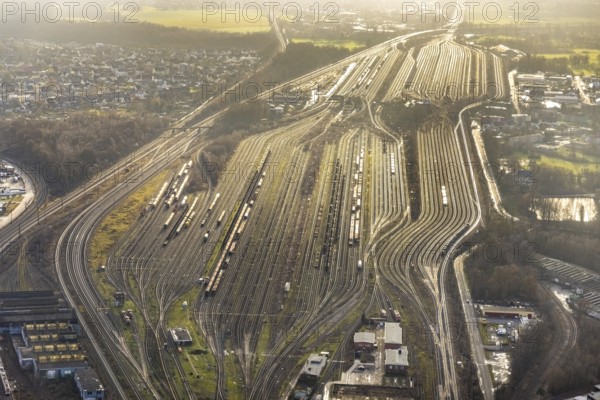 Aerial view shunting yard and freight yard in backlight in Hamm, Ruhr area, North Rhine-Westphalia, Germany, railway tracks, railway station, DE, Deutsche Bahn AG, Europe, backlight, railway tracks, Hamm, aerial view, aerial photograph, aerial photography, aerial photography, Rhine-Ruhr metropolitan region, overview, bird's eye view, birds-eyes view, former signal box, overview
