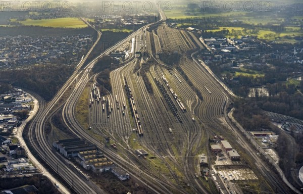Aerial view shunting yard and freight yard in backlight in Hamm, Ruhr area, North Rhine-Westphalia, Germany, railway tracks, railway station, DE, Deutsche Bahn AG, Europe, backlight, railway tracks, Hamm, aerial view, aerial photograph, aerial photography, aerial photography, Rhine-Ruhr metropolitan region, overview, bird's eye view, birds-eyes view, former signal box, overview