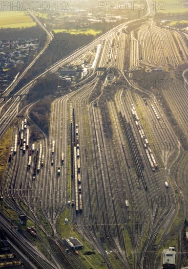 Aerial view shunting yard and freight yard in backlight in Hamm, Ruhr area, North Rhine-Westphalia, Germany, railway tracks, railway station, DE, Deutsche Bahn AG, Europe, backlight, railway tracks, Hamm, aerial view, aerial photograph, aerial photography, aerial photography, Rhine-Ruhr metropolitan region, overview, bird's eye view, birds-eyes view, former signal box, overview