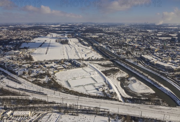 Aerial view, Hamm EDLH airfield, Lippe, Datteln-Hamm canal, bridge federal road B63 Münsterstraße, sports facility HTC Hockey- und Tennisclub Hamm, Gymnasium Hammonense, water sports centre, snow-covered areas, winter, centre, Hamm, Ruhr area, North Rhine-Westphalia, Germany, DE, Europe, aerial view, aerial photography, aerial photography, snow, overview, bird's eye view, birds-eyes, view, overview, Lippemäander, Hammonense, EDLH, waterway, shipping, transport, logistics, goods movement, ships, waters, education, pupils, college, training, school year, homework, class, year group, education, pedagogy, airfield, flying, air sports, leisure, pilot, grass pitch, artificial grass pitch, football, sport, training, football match, football pitch, hobby, championship, athlete, team, sports field, sports facility, clay court, tennis, tennis playing, tennis club