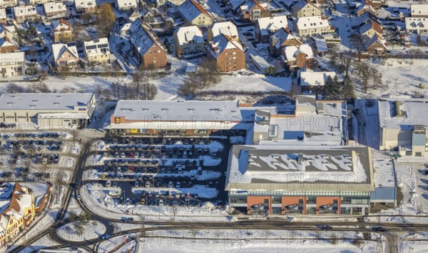 Aerial view, shopping centre, Aldi, Lidl, Edeka, car park, Westpress-Arena, snow, winter, Uentrop, Hamm, Ruhr area, North Rhine-Westphalia, Germany, DE, Europe, aerial view, aerial photography, aerial photography, overview, bird's-eye view, birds-eyes, view, overview, gymnastics, school sports, ball sports, fitness, sports, movement, shopping, food, goods, shopping, textiles, consumption, parking, cars, parking area
