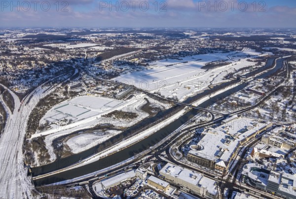 Aerial photo, Hamm EDLH airfield, Lippe, Datteln-Hamm canal, bridge federal road B63 Münsterstraße, sports facility HTC Hockey- und Tennisclub Hamm, Alleecenter, snow-covered areas, winter, centre, Hamm, Ruhr area, North Rhine-Westphalia, Germany, DE, Europe, aerial photo, aerial photography, aerial photography, snow, overview, bird's-eye view, view, overview, Lippemäander, EDLH, waterway, shipping, transport, logistics, goods movement, ships, waters, shopping, food, goods, shopping, textiles, consumption, airfield, flying, air sports, leisure, pilot, grass pitch, artificial grass pitch, football, sport, training, football match, football pitch, hobby, championship, athlete, team, sports field, sports facility, clay court, tennis, tennis playing, tennis club