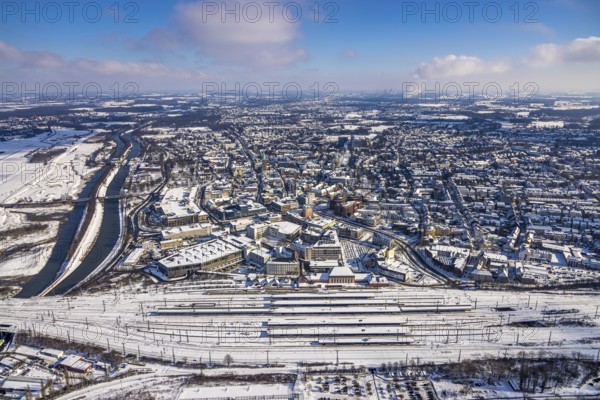 Aerial view, Hamm main station, tracks and platforms in the snow, winter, overview centre, Datteln-Hamm canal, Hamm, Ruhr area, North Rhine-Westphalia, Germany, DE, Europe, aerial view, aerial photography, aerial photography, snow, overview, bird's-eye view, birds-eyes, view, overview, main station, train traffic, railway traffic, traffic connection, travel, holiday, federal railway, German, railway, tracks, trains, transport, traffic, rails, waterway, shipping traffic, logistics, movement of goods, ships, waters, cinema, films, entertainment, leisure, culture