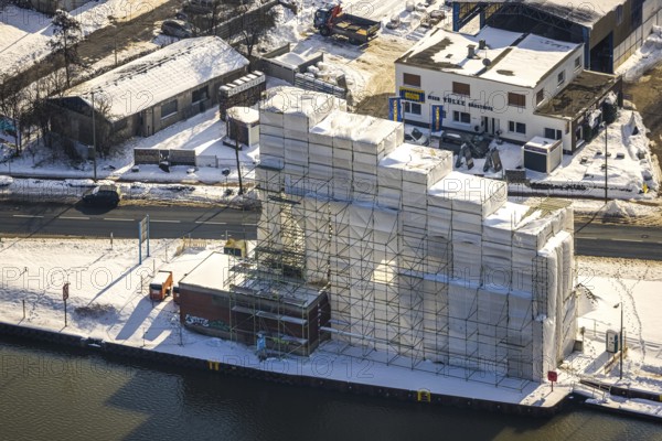 Aerial view, construction site renovation of the historic crane in Hammer harbour, technical monument, Datteln-Hamm canal, winter, snow, Bockum-Hövel, Hamm, Ruhr area, North Rhine-Westphalia, Germany, DE, Europe, aerial view, aerial photography, aerial photography, overview, bird's-eye view, birds-eyes, view, overview, technical, monument, gantry crane, Rhenus crane, water, waterways, shipping, transport, logistics, goods, trade, infrastructure, waterway, goods movement, ships, waters