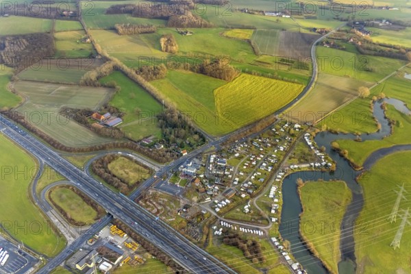 Aerial view motorway A2 with motorway junction Hamm-Uentrop and planned industrial area Westfalen Hamm/Lippetal at the main road in Hamm, Ruhr area, North Rhine-Westphalia, Germany, motorway junction, camping, camping site Uentrop Helbach, DE, Europe, river Lippe meander, commercial area, commercial area, commercial location, Hamm, industrial area, industrial location, aerial view, aerial photograph, aerial photography, aerial photography, Rhine-Ruhr metropolitan region, overview, bird's-eye view, bird's-eye view, overview