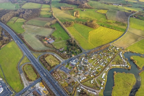 Aerial view motorway A2 with motorway junction Hamm-Uentrop and planned industrial area Westfalen Hamm/Lippetal at the main road in Hamm, Ruhr area, North Rhine-Westphalia, Germany, motorway junction, camping, camping site Uentrop Helbach, DE, Europe, river Lippe meander, commercial area, commercial area, commercial location, Hamm, industrial area, industrial location, aerial view, aerial photograph, aerial photography, aerial photography, Rhine-Ruhr metropolitan region, overview, bird's-eye view, bird's-eye view, overview