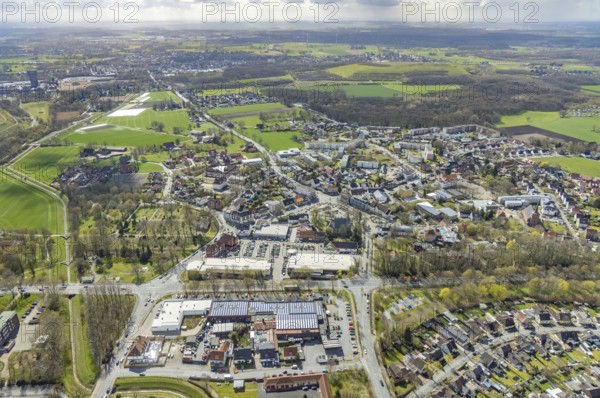 Aerial view, Lippecarree shopping centre at Herringer Markt, Evangelical St. Victor Church, Herringen, Hamm, Ruhr area, North Rhine-Westphalia, Germany, place of worship, DE, shopping centre, shopping place, shopping mall, Europe, religious community, place of worship, holy place, church, church community, denomination, aerial view, aerial photography, aerial photography, local supply centre, religion, religious site, shopping centre, overview, bird's-eye view, overview