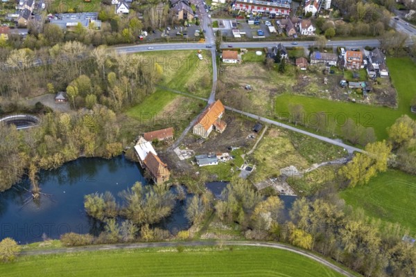 Aerial view, planned renovation of the castle mill on the millrace at the mill pond, Heckmann development area, An der Schlossmühle An der Schlossmühle development area in Heessen, Hamm, Ruhr area, North Rhine-Westphalia, Germany, DE, monument protection, Europe, Lippe floodplain, Lippeauen, aerial photograph, aerial photography, aerial photography, mill, rainwater retention basin, pond, overview, bird's-eye view, woodland, birds-eyes view, former flour mill, dilapidated condition, overview