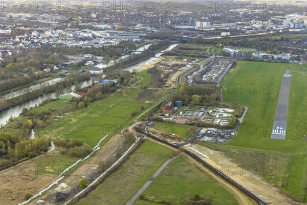 Aerial view, Lippe floodplain experience project, dyke area between city centre and airfield, new course of the flood dyke, river Lippe and Datteln-Hamm canal, Heessen, Hamm, Ruhr area, North Rhine-Westphalia, Germany, construction area, construction site, building plots, construction project, DE, Europe, flight emission, aircraft noise, airfield, Hamm airfield, runway, aerial view, aerial photography, aerial photography, runway, overview, bird's eye view, birds-eyes view, overview