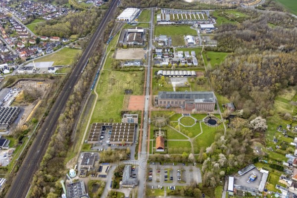 Aerial view, commercial area Ökozentrum Sachsenweg in Heessen, Hamm, Ruhr area, North Rhine-Westphalia, Germany, railway tracks, DE, Europe, commercial enterprises, commercial area, commercial park, commercial location, commercial use, industrial area, industrial building, industrial culture, industrial site, Keolis Deutschland GmbH, aerial view, aerial photography, aerial photography, SMT Scharf AG, Sondermann-Brot Bäckerei, overview, event location, event venue, event centre, bird's-eye view, forest area, birds-eyes view, overview, Öko-Zentrum North Rhine-Westphalia