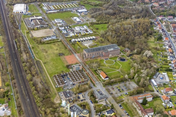 Aerial view, commercial area Ökozentrum Sachsenweg, Alfred-fisherman-Halle in Heessen, Hamm, Ruhr area, North Rhine-Westphalia, Germany, railway tracks, DE, Europe, commercial enterprises, commercial area, commercial park, commercial location, commercial use, industrial area, industrial building, industrial culture, industrial site, Keolis Deutschland GmbH, aerial view, aerial photography, aerial photography, SMT Scharf AG, Sondermann-Brot Bäckerei, overview, event location, event venue, event centre, bird's-eye view, forest area, birds-eyes view, overview, Öko-Zentrum North Rhine-Westphalia