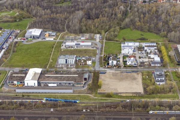 Aerial view, commercial area Ökozentrum Sachsenweg in Heessen, Hamm, Ruhr area, North Rhine-Westphalia, Germany, railway tracks, DE, Europe, commercial enterprises, commercial area, commercial park, commercial location, commercial use, industrial area, industrial building, industrial culture, industrial site, Keolis Deutschland GmbH, aerial view, aerial photography, aerial photography, SMT Scharf AG, Sondermann-Brot Bäckerei, overview, event location, event venue, event centre, bird's-eye view, forest area, birds-eyes view, overview, Öko-Zentrum North Rhine-Westphalia