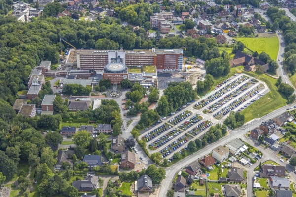 Aerial view, St. Barbara-Klinik Hamm-Heessen with extension construction site in the Heessen district, Hamm, Ruhr area, North Rhine-Westphalia, Germany, construction work, construction area, building site, building plots, construction project, construction site, DE, Europe, healthcare, hospital, helipad, clinic, clinic centre, hospital, hospital, aerial photograph, aerial photography, aerial photography, medical facility, medical aid, new building, car park, overview, bird's eye view, birds-eyes view, overview, medical care