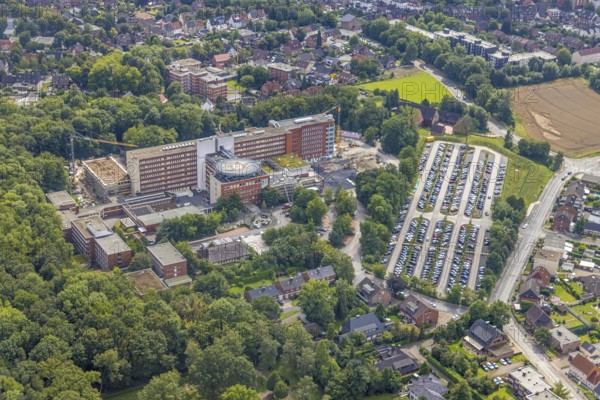 Aerial view, St. Barbara-Klinik Hamm-Heessen with extension construction site in the Heessen district, Hamm, Ruhr area, North Rhine-Westphalia, Germany, construction work, construction area, building site, building plots, construction project, construction site, DE, Europe, healthcare, hospital, helipad, clinic, clinic centre, hospital, hospital, aerial photograph, aerial photography, aerial photography, medical facility, medical aid, new building, car park, overview, bird's eye view, birds-eyes view, overview, medical care