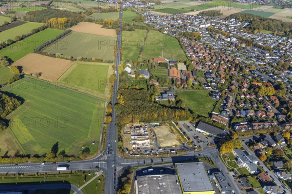 Aerial view, construction area and new building for Mensing Galerie corner Werler Straße and Unnaer Straße and in the district Rhynern in Hamm, Ruhr area, North Rhine-Westphalia, Germany, construction work, construction area, building site, building plots, construction project, construction site, DE, Europe, gallery, commercial enterprises, commercial area, commercial area, commercial location, commercial use, Hamm, culture, art, aerial view, aerial photography, aerial photography, new building, overview, bird's eye view, birds-eyes view, overview