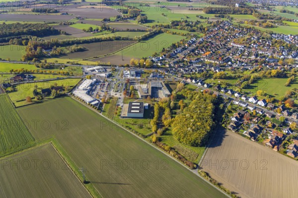 Aerial view, Konrad-Adenauer Realschule and Rewe Räker supermarket in the district Rhynern in Hamm, Ruhr area, North Rhine-Westphalia, Germany, education, educational institution, DE, shopping markets, shopping place, shopping centre, Europe, Hamm, educational institute, aerial view, aerial photography, aerial photography, local supply centre, secondary school, school, supermarket, overview, bird's eye view, birds-eyes view, overview