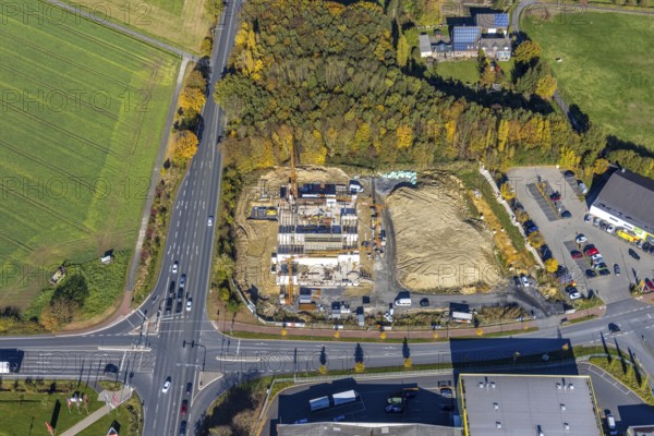 Aerial view, construction area and new building for Mensing Galerie corner Werler Straße and Unnaer Straße and in the district Rhynern in Hamm, Ruhr area, North Rhine-Westphalia, Germany, construction work, construction area, building site, building plots, construction project, construction site, DE, Europe, gallery, commercial enterprises, commercial area, commercial area, commercial location, commercial use, Hamm, culture, art, aerial view, aerial photography, aerial photography, new building, overview, bird's eye view, birds-eyes view, overview