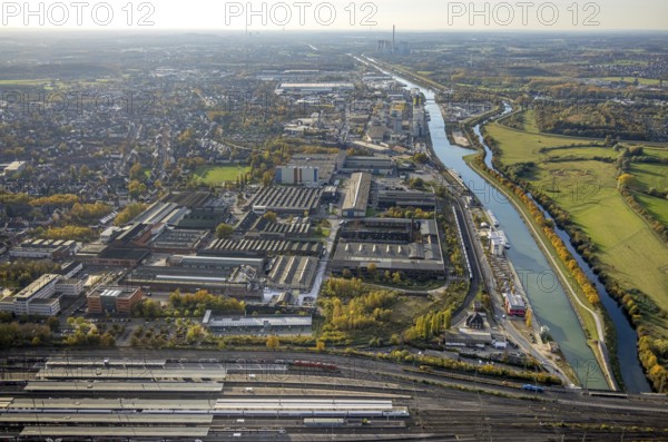 Aerial view, view from the central station to the harbour area with Datteln-Hamm canal and river Lippe and the RWE Power AG power plant Gersteinwerk in the background in the district Mitte in Hamm, Ruhr area, North Rhine-Westphalia, Germany, DE, Europe, distant view, commercial enterprises, commercial area, commercial location, commercial use, harbour, Hamm, industrial area, industrial location, canal, power plant, aerial view, aerial photography, aerial photography, overview, bird's-eye view, bird's-eye view, overview