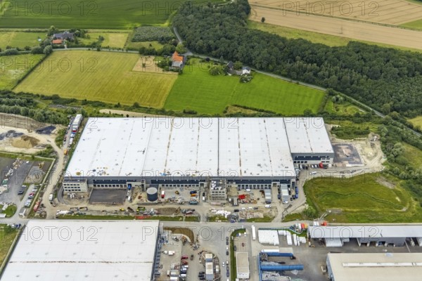 Aerial view, construction site and new building in DistributionPark Hamm, Trianelstraße and K'Park-Straße, two building complexes with offices and warehouses for logistics, Uentrop, Hamm, Ruhr area, North Rhine-Westphalia, Germany, DE, Europe, commercial enterprises, commercial area, business park, commercial location, commercial use, Hines Immobilien, industrial area, industrial building, industrial location, logistics, logistics service, logistics service provider, logistics provider, logistics centre, aerial view, aerial photography, aerial photography, transport service, overview, bird's-eye view, overview
