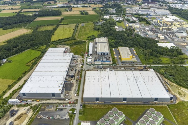 Aerial view, construction site and new building DistributionPark Hamm, Trianelstraße and K'Park-Straße, two building complexes with offices and warehouses for logistics, Deutsche Post DHL - Mech ZB Hamm, Uentrop, Hamm, Ruhr area, North Rhine-Westphalia, Germany, DE, Europe, commercial enterprises, commercial area, commercial park, commercial location, commercial use, Hines Immobilien, industrial area, industrial building, industrial location, logistics, logistics service, logistics service provider, logistics provider, logistics centre, aerial view, aerial photography, aerial photography, transport service, overview, bird's-eye view, overview