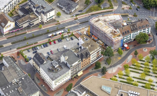 Aerial view, city centre view with Platz der Deutschen Einheit at Hamm main station as well as construction site and new residential building on the former site of the Kippâ'¬â¢n in Bahnhofstraße in Mitte, Hamm, Ruhr area, North Rhine-Westphalia, Germany, Bahnhofstraße, construction work, construction area, construction site, building plots, construction project, construction site, DE, Europe, commercial buildings, aerial view, aerial photography, aerial photography, new construction, square, overview, bird's-eye view, overview, city centre view City with Platz der Deutschen Einheit at Hamm main station as well as construction site and new residential building on the former site of the Kipp'™n in Bahnhofstraße in Mitte