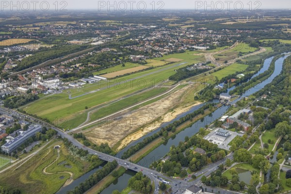 Aerial view, construction site of the Lippe floodplain experience project on the River Lippe and Datteln-Hamm Canal and the course of the flood embankment between Münsterstraße and Fährstraße as well as Hamm-Lippewiesen airfield, EDLH, special airfield, LSC-Hamm, in the Heessen district of Hamm, Ruhr area, North Rhine-Westphalia, Germany, construction work, construction area, building site, building plots, construction project, construction site, DE, Europe, airfield, Hamm, runway, aerial view, aerial photography, aerial photography, runway, overview, bird's-eye view, overview