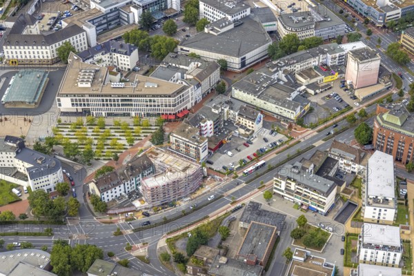 Aerial view, city centre view city with Platz der Deutschen Einheit at Hamm main station as well as construction site and new residential building on the former site of the Kippâ'¬â¢n in Bahnhofstraße in Mitte, Hamm, Ruhr area, North Rhine-Westphalia, Germany, Bahnhofstraße, construction work, construction area, construction site, building plots, construction project, construction site, bunker, DE, Europe, commercial buildings, high bunker, aerial view, aerial photography, aerial photography, new construction, square, overview, bird's-eye view, overview, city centre view City with Platz der Deutschen Einheit at Hamm main station as well as construction site and new residential building on the former site of the Kipp'™n in Bahnhofstraße in Mitte