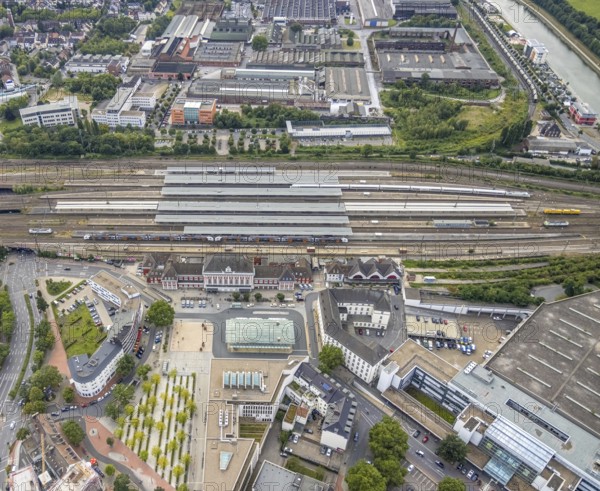 Aerial view, city centre view with Platz der Deutschen Einheit and Hamm Westf. central station in Mitte, Hamm, Ruhr area, North Rhine-Westphalia, Germany, railway tracks, railway station, station forecourt, DE, Deutsche Bahn AG, Europe, commercial buildings, central station, main station, aerial view, aerial photography, aerial photography, square, overview, bird's-eye view, overview