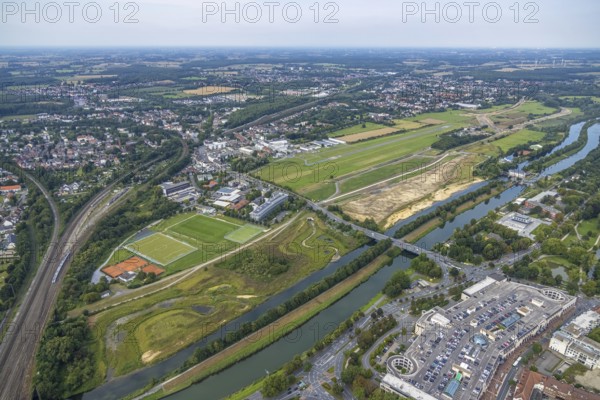 Aerial view, construction site of the Lippe floodplain experience project on the River Lippe and Datteln-Hamm Canal and the course of the flood embankment between Münsterstraße and Fährstraße as well as Hamm-Lippewiesen airfield, EDLH, special airfield, LSC-Hamm, in the Heessen district of Hamm, Ruhr area, North Rhine-Westphalia, Germany, construction work, construction area, building site, building plots, construction project, construction site, DE, Europe, airfield, Hamm, runway, aerial view, aerial photography, aerial photography, runway, overview, bird's-eye view, overview