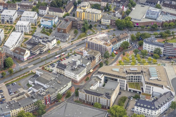 Aerial view, city centre view with Platz der Deutschen Einheit at Hamm main station as well as construction site and new residential building on the former site of the Kippâ'¬â¢n in Bahnhofstraße in Mitte, Hamm, Ruhr area, North Rhine-Westphalia, Germany, Bahnhofstraße, construction work, construction area, construction site, building plots, construction project, construction site, DE, Europe, commercial buildings, aerial view, aerial photography, aerial photography, new construction, square, overview, bird's-eye view, overview, city centre view City with Platz der Deutschen Einheit at Hamm main station as well as construction site and new residential building on the former site of the Kipp'™n in Bahnhofstraße in Mitte