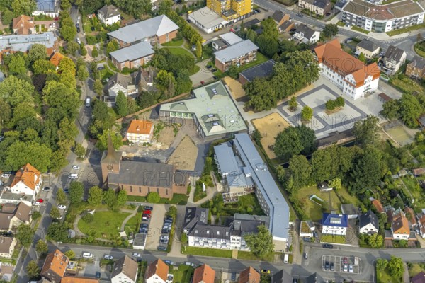 Aerial view, catholic Heilig Kreuz church and Caritas retirement home St. Josef in the district of Herringen in Hamm, Ruhr area, North Rhine-Westphalia, Germany, old people's home, retirement home, old people's home, place of worship, care and nursing, DE, Europe, religious community, place of worship, Hamm, holy place, church, parish, denomination, aerial view, aerial photography, aerial photography, care facility, religion, religious site, retirement home, retirement residence, retirement home, retirement centre, overview, bird's eye view, birds-eyes view, overview