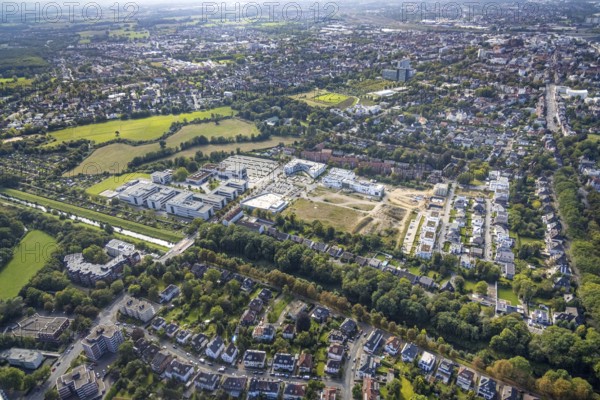 Aerial view, Hamm-Lippstadt University of Applied Sciences and the construction site at SCI:Q Science Quarter in the Mitte district of Hamm, Ruhr area, North Rhine-Westphalia, Germany, construction work, building, construction area, building site, building plots, construction project, construction site, education, educational institution, DE, Europe, aircraft, business park, property tax, Hamm, real estate, industrial area, aerial photograph, aerial photography, aerial photography, Marker Allee, Rhine-Ruhr metropolitan region, new building, Paracelsuspark, Science Quarter Hamm, sailor, tech park, overview, university, bird's-eye view, science quarter, residential complex, living and living, residential area, residential buildings, residential quality, residential quarter, housing estate, birds-eyes view, overview